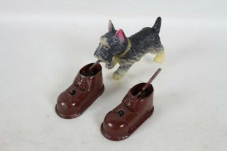 Vintage Occupied Japan Celluloid & Tin Wind Up Scottie Dog Biting Shoe Toy