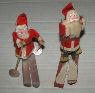 2 Vintage Christmas Clay Face Santa Claus On Skis Ornament Japan