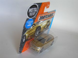 MATCHBOX (2016) ' 11 BMW M1 SERIES 1 M COUPE 2011 IN GOLD ON SHORT CARD MOC 3