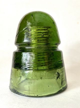Antique Olive Green Glass Insulator With Embossed Star
