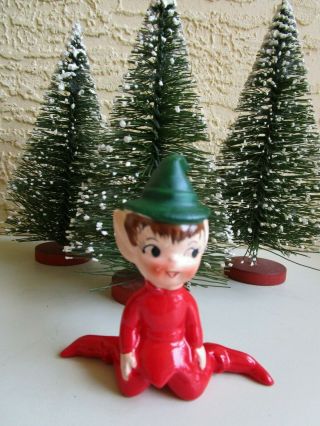 Vintage Elf/pixie Green Hat Red Suit Sitting Legs To Back Ceramic Xmas Figurine