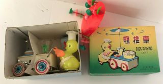 China Duck Wind - Up Pushing Cart Ms 717 Tin And Plastic