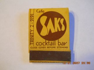 Old " Feature " Matchbook Of Cafe Saks Cocktail Bar