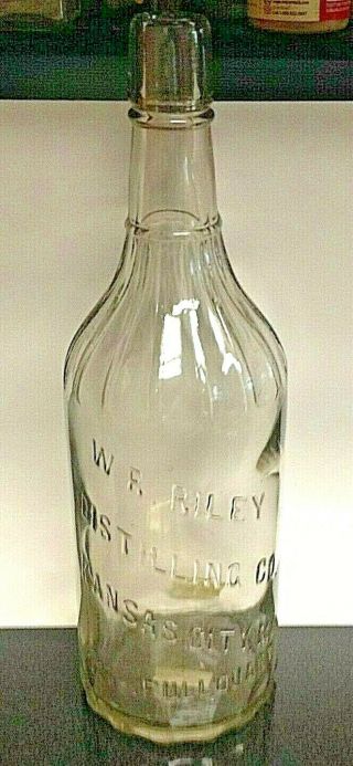 W.  E.  Riley Distilling Co.  Kansas City Missouri,  Whiskey Bottle,  Full Quart.  Emb