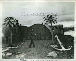 1942 Press Photo Iceland,  A Marine Walks Past Artificial Palm Trees On The Base