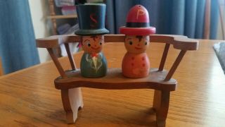 Vintage Wooden Man & Woman Salt And Pepper Shakers On Bench