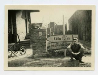 Photo Of A Gi In Front Of German Road Sign.