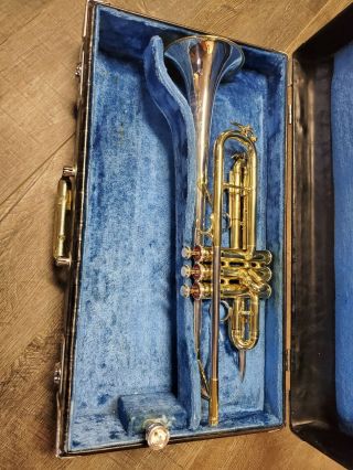 Vintage King H.  N.  White 20 Symphony Silversonic Trumpet Player