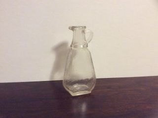 Vintage small flat glass bottle with K in keystone makers mark 2