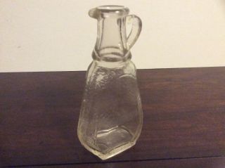 Vintage small flat glass bottle with K in keystone makers mark 3
