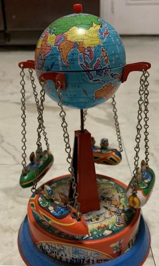German Collectible Tin Toy Carousel With Rocket Ships