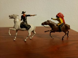 Vintage Painted Metal Cowboy And Indian Riding Horses