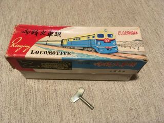 Tin Toy Locomotive Wind Up With Key And Box,  About 8 Inches Long.