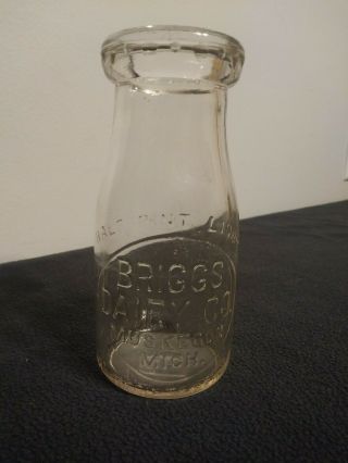 Vintage Briggs Dairy Co.  Muskegon Mi 1/2 Pint Clear Glass Embossed Bottle Jug