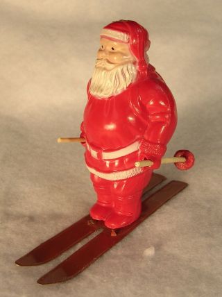 Vintage Plastic Santa Claus On Tin Litho Skis Christmas Decoration