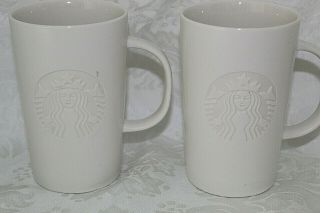 Starbucks 2 Ceramic 12 Oz Coffee Mugs 2014 White On White Embossed Siren Logo