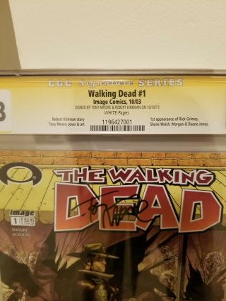 WALKING DEAD 1 CGC 9.  8 SIGNED BY ROBERT KIRKMAN AND TONY MOORE BLACK LABEL 2