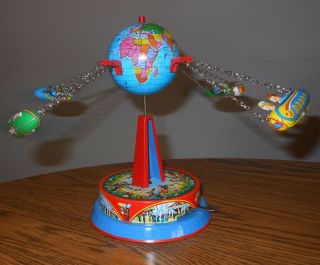 Vintage Tin Litho Wind Up Toy - Planes Flying Around The World Globe Cowboy/indi