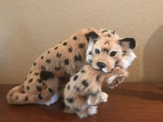 Realistic Leopard Holding Baby Made Out Of Rabbit Fur