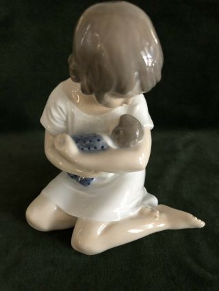 Royal Copenhagen Figurine Girl With Doll In Her Arms No.  1938