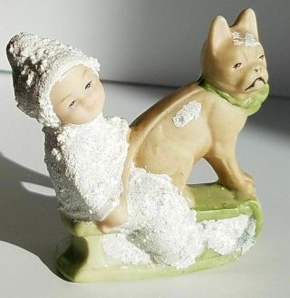 Adorable Snowbaby Like Child On Sled With Tan Boxer Dog Christmas Figurine