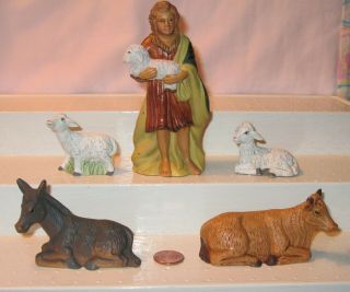 A Set Of 5 Hard Polyresin Nativity Figure; Shepherd,  2 Lambs,  Oxen And Donkey