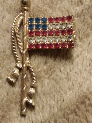Dar American Flag Pin W/ Red,  Blue,  N Clear Rhinestones,  Gold Toned Metal Body