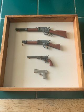 Vintage Mini Cast Iron Toy Guns On Wood Plaque,  Dead Or Alive Mares Laig Gun