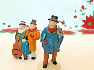 4 Christmas Village Figure 3 O ' Well Cow,  Boy Raking,  Man & 1 Dept 56 Musicians 3