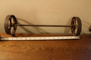 Two Very Old 4 1/2 " Cast Iron Wheels With 5/16 " By 16 3/4 " Steel Axel