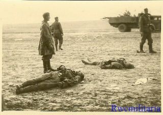 Sad Wehrmacht Soldiers Look At Kia Russian Soldiers Laying In Open Field
