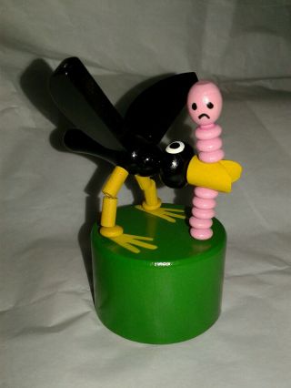 Wooden Push Button Puppet Black Bird And Pink Worm