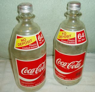 2 Vintage Coca Cola Bottles,  64 Oz,  Clear Plastic Coated Glass,  Caps,  1980 