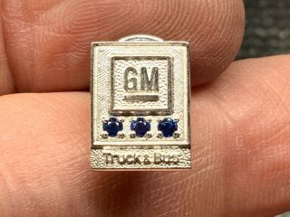 General Motors 1/10 10k Gold Triple Sapphire Truck & Bus Service Award Pin.