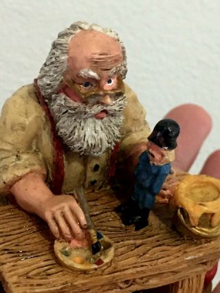 VINTAGE SANTA sitting on wood painting a toy soldier collectible figurine 2