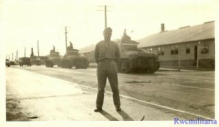 Port.  Photo: Great Line Of M3 Lee Tanks Pass By Us Soldier On Road By Barracks