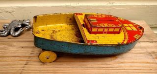 Vintage Tin Boat With Wooden Wheels Pull Toy Or Display