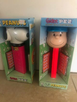 2 Giant Peanuts Pez Dispensers.  Snoopy And Charlie Brown.  Plays Music.
