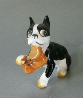 Vintage Porcelain Small Ornament Figure Of A French Bulldog With A Boot