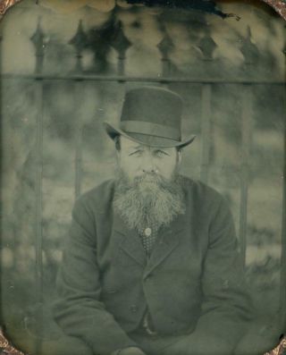 Outdoors Sixth Plate Ambrotype Of Man Sitting In Front Of Iron Wrought Fence