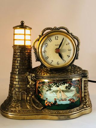 Vintage United Clock Corp Brass Tone Sailboats Lighthouse Motion Clock