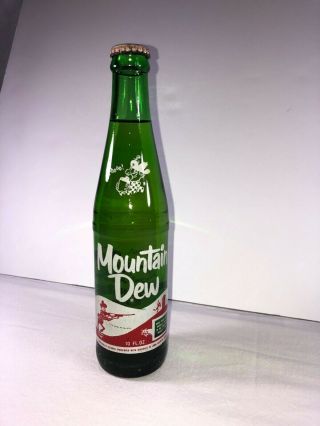Full 10 Oz Mountain Dew Hillbilly Green Bottle Laughing Pig,  1960’s Vintage