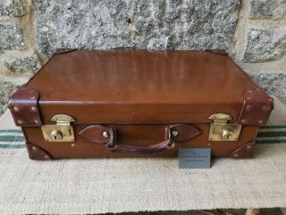 A Vintage Tan Leather Suitcase