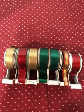 7 VINTAGE HRISTMAS METAL SCOTCH TAPE DISPENSERS SEVERAL COLORS OF TAPE. 2