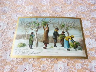 Victorian Christmas Card/figures Picking Mistletoe From Trees In The Snow