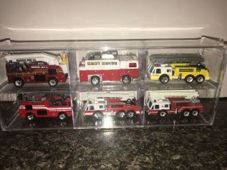 Matchbox Assorted Trucks In Acrylic Case 1981,  1991.  1982,  1981.  1982
