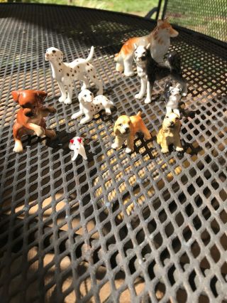 9 Assorted Dog Figurines Appear To Be Of Bone China And Glass