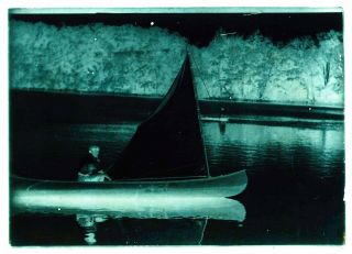 LATE 1800s EARLY 1900s GLASS NEGATIVE,  MAN WITH PIPE IN SAILING CANOE - UNKNOWN 2