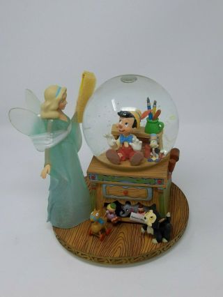 Disney Pinocchio & The Blue Fairy Snow Globe,  Music Box Plays " Toyland "