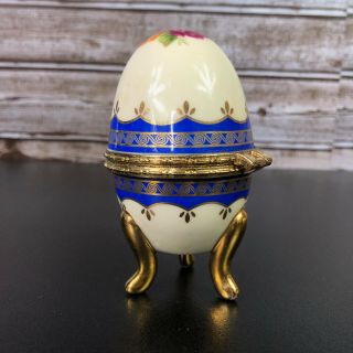 Faberge Egg Hand Painted Gold and Navy Trim on Pedestal with Hinge to Open 3